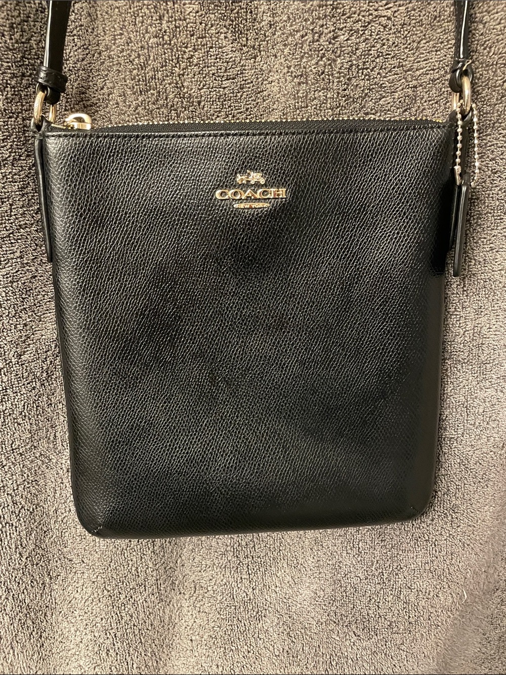 Very sharp Coach Black Leather Crossbody with Gold Logo.